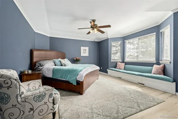 a bedroom with two beds and a couch
