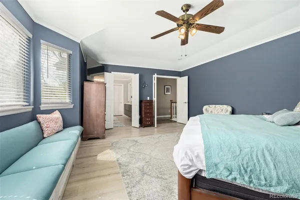 a bedroom with a bed and ceiling fan