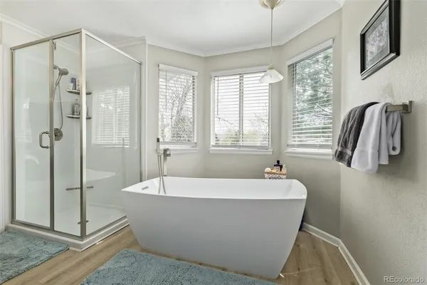 a white bath tub sitting next to a window