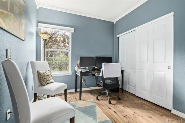 a workspace with furniture and a window