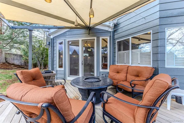 a view of a patio with a table and chairs