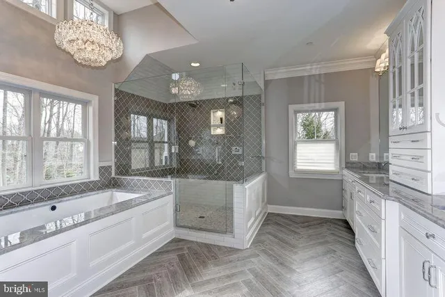 a room with a book shelf and a window