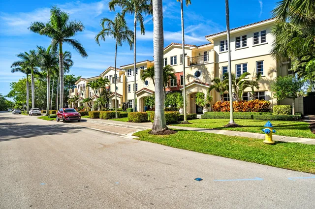 a view of a apartment building with a yard