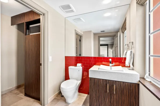 a bathroom with a sink a vanity and a mirror