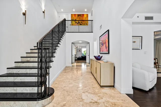 a view of entryway with wooden floor and stairs