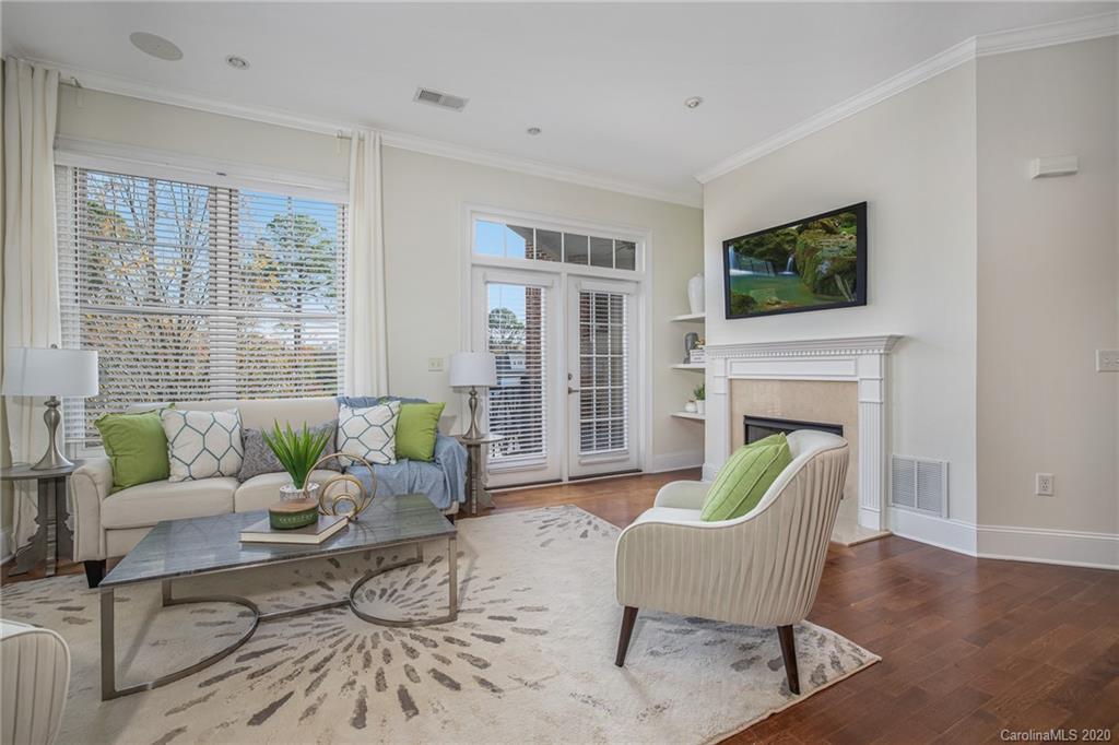 5425 Closeburn Road, Unit 212 Charlotte, NC 28210 - Photo 2 of 14 a living room with furniture and a fireplace