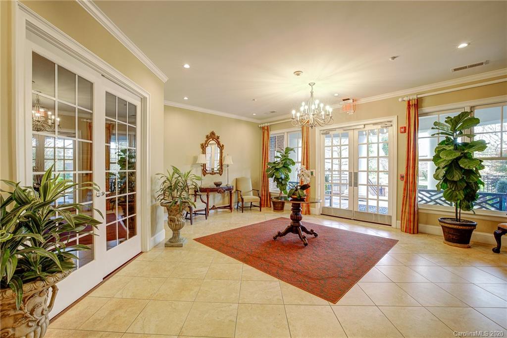 5425 Closeburn Road, Unit 212 Charlotte, NC 28210 - Photo 13 of 14 a living room filled with furniture and potted plants