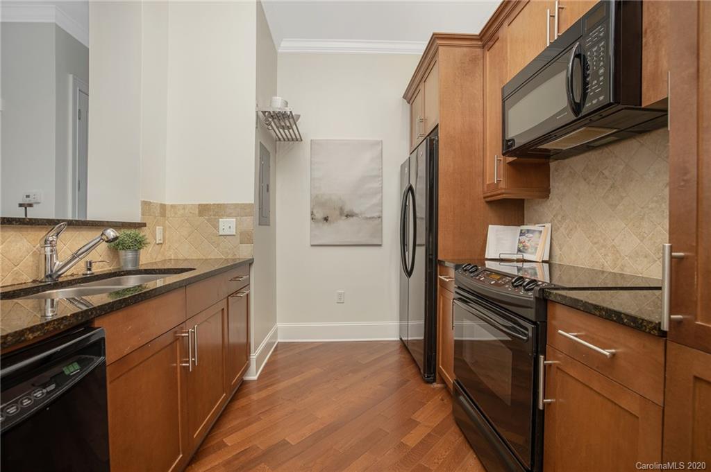 5425 Closeburn Road, Unit 212 Charlotte, NC 28210 - Photo 4 of 14 a kitchen with a sink stove and refrigerator