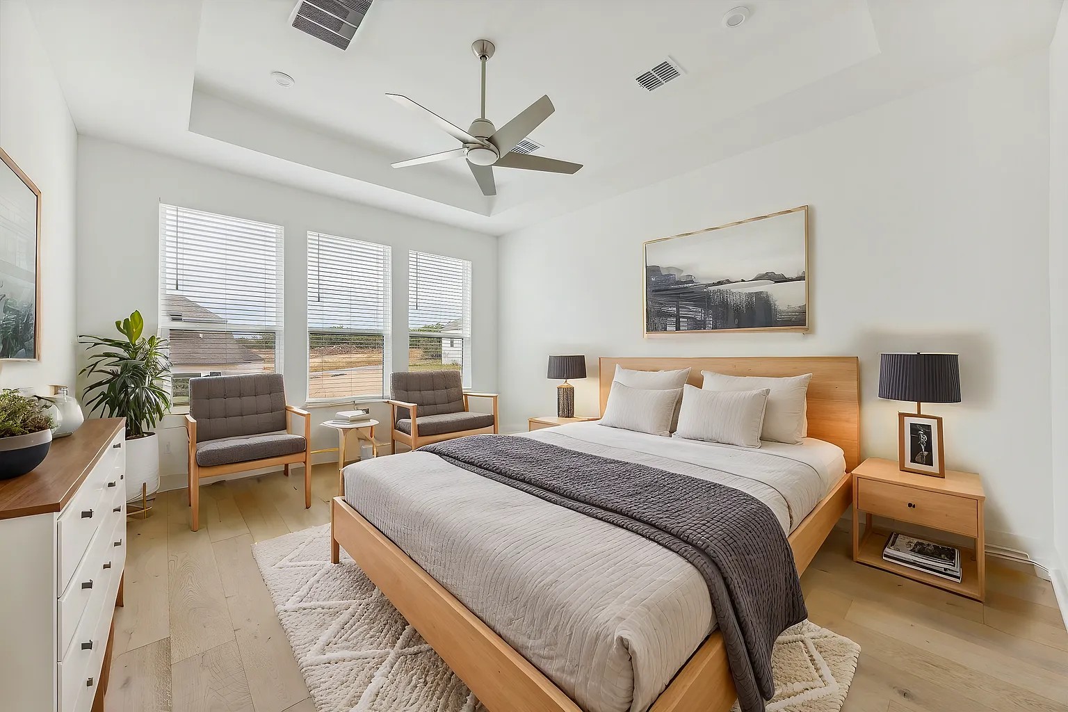 1909 Varese Path Leander, TX 78641 - Photo 17 of 40 A tranquil haven featuring light hardwood flooring and a stylish ceiling fan, perfect for unwinding.