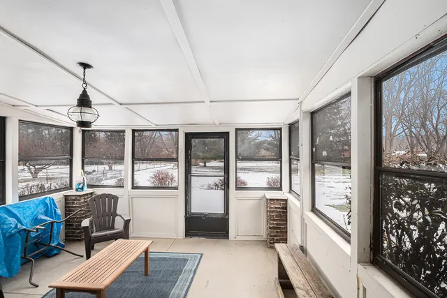 a view of a house with a snow in the background