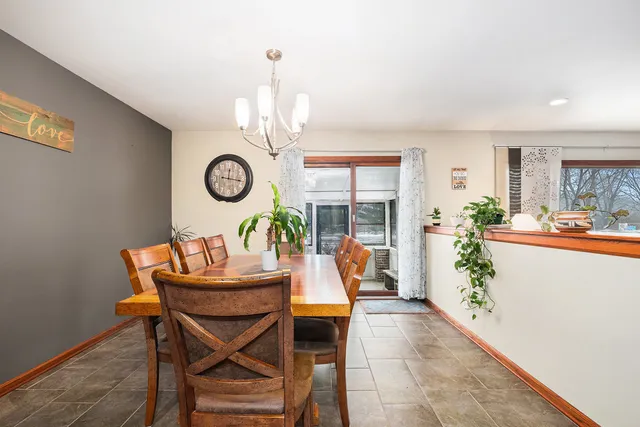 a living room with furniture and chandelier