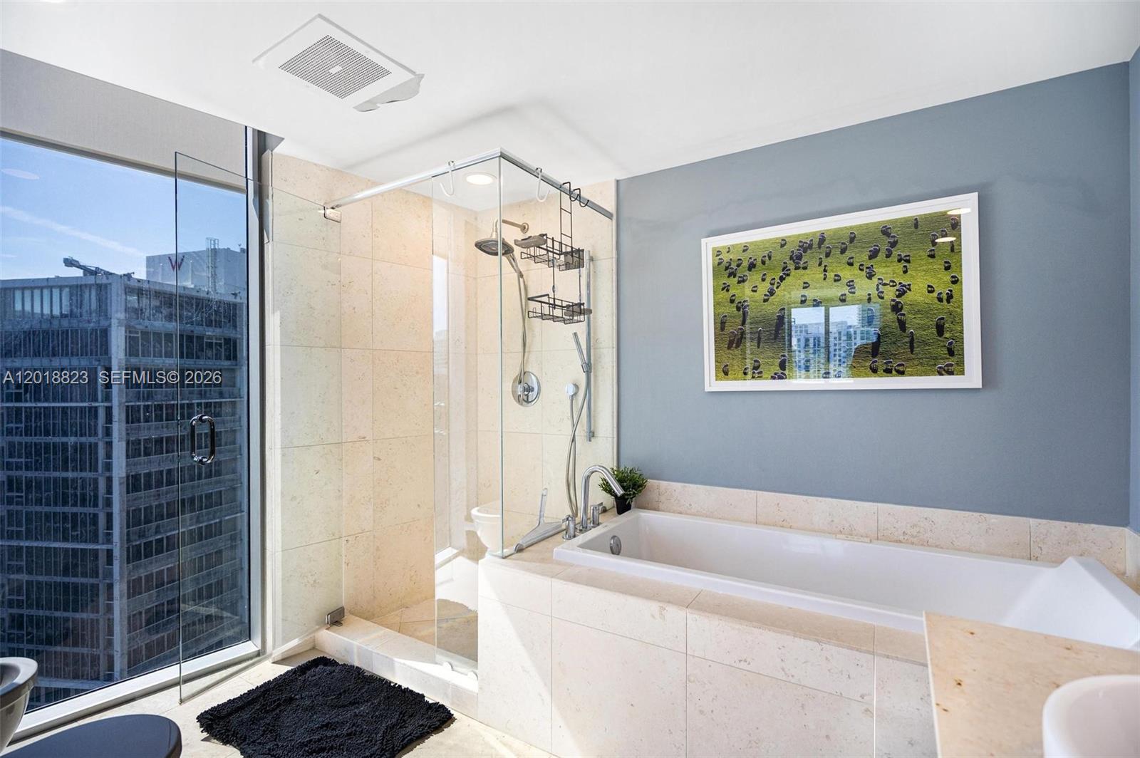 495 Brickell Avenue, Unit 4911 Miami, FL 33131 - Photo 25 of 35 a bath room with a bath tub and a shower