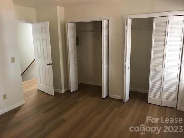 6717 Bevington Ridge Road, Unit A Charlotte, NC 28277 - Photo 13 of 15 an empty room with wooden floor and a bathroom