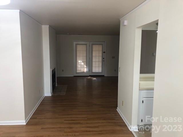 6717 Bevington Ridge Road, Unit A Charlotte, NC 28277 - Photo 3 of 15 a view of a hallway with wooden floor and staircase
