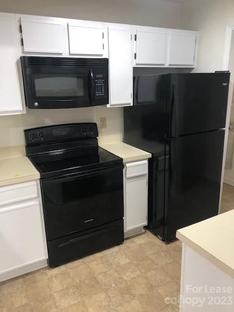 6717 Bevington Ridge Road, Unit A Charlotte, NC 28277 - Photo 4 of 15 a kitchen with stainless steel appliances a stove microwave and refrigerator