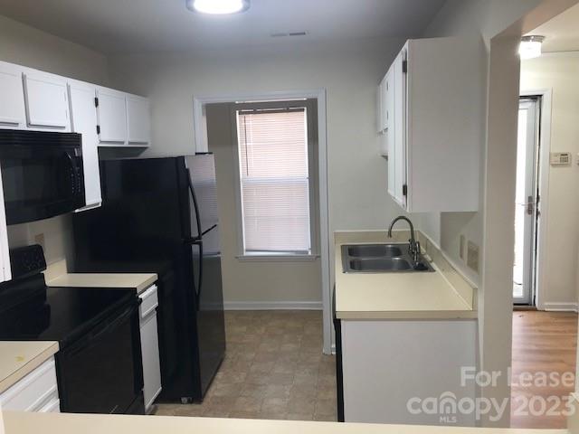 6717 Bevington Ridge Road, Unit A Charlotte, NC 28277 - Photo 5 of 15 a kitchen with stainless steel appliances a refrigerator sink and stove