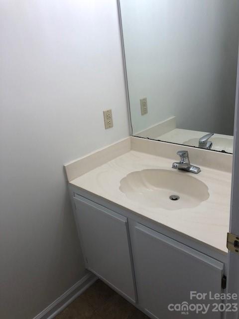 6717 Bevington Ridge Road, Unit A Charlotte, NC 28277 - Photo 7 of 15 a bathroom with a sink and a mirror