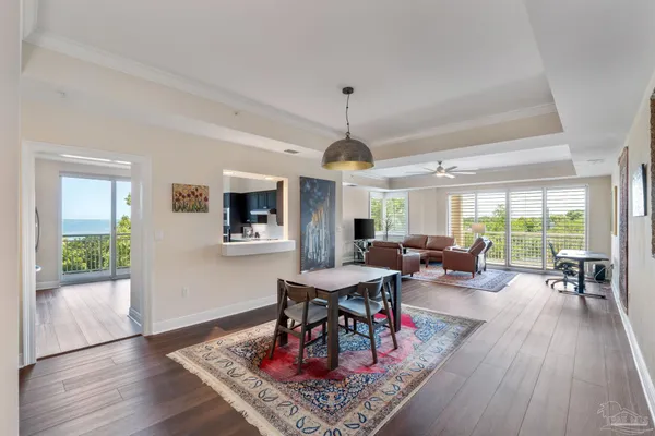 a view of a dining room with furniture window and wooden floor
