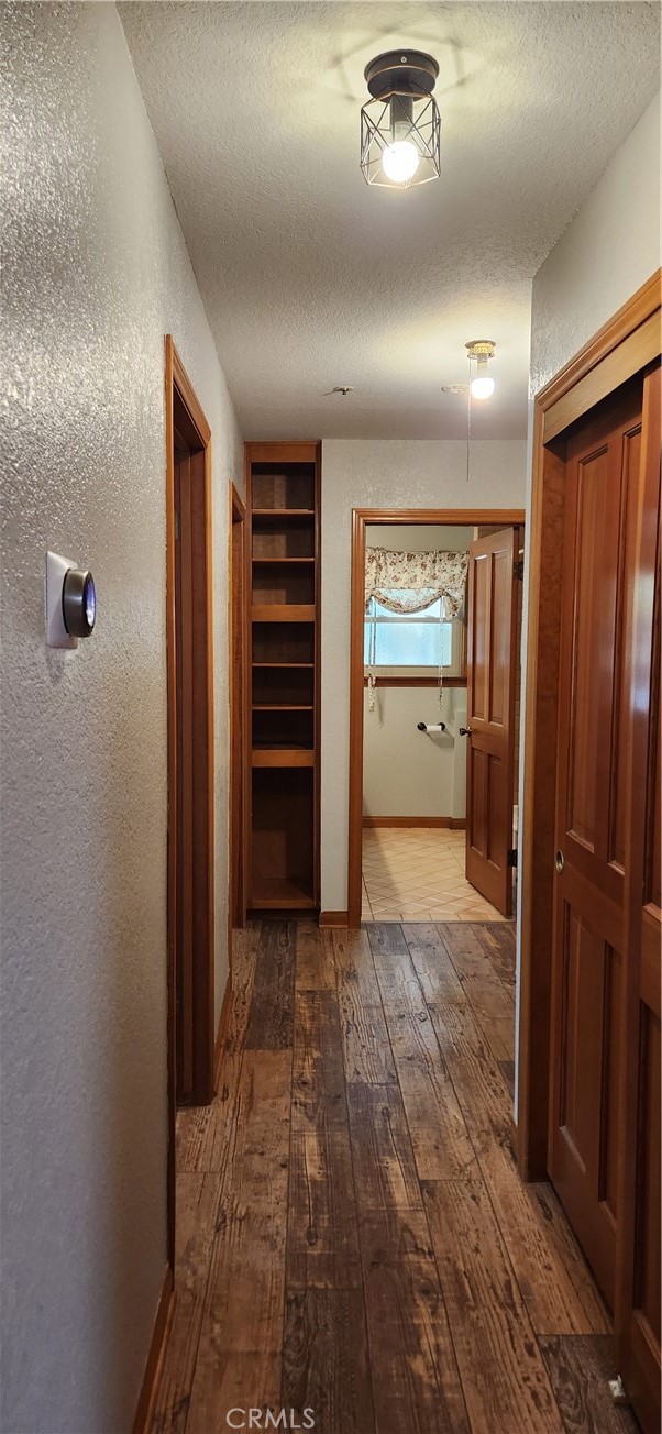 29932 Louis Avenue Canyon Country, CA 91351 - Photo 11 of 46 an empty room with closet and wooden floor