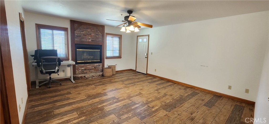 29932 Louis Avenue Canyon Country, CA 91351 - Photo 19 of 46 a room with chandelier fan and windows