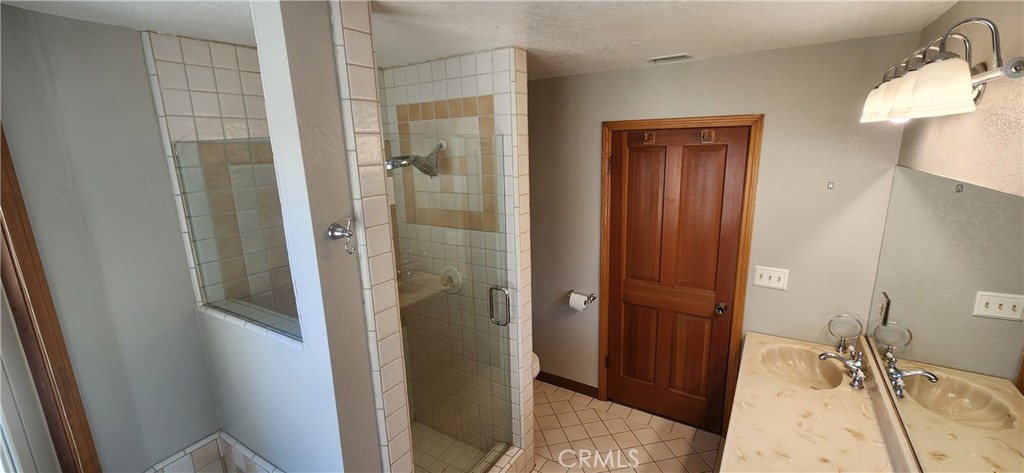 29932 Louis Avenue Canyon Country, CA 91351 - Photo 21 of 46 a bathroom with a sink and shower