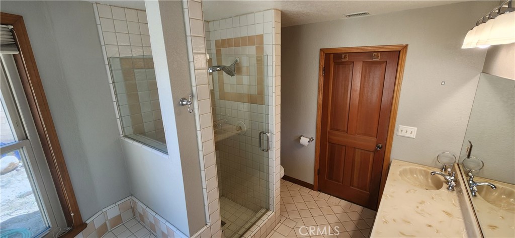 29932 Louis Avenue Canyon Country, CA 91351 - Photo 22 of 46 a bathroom with a tub and shower