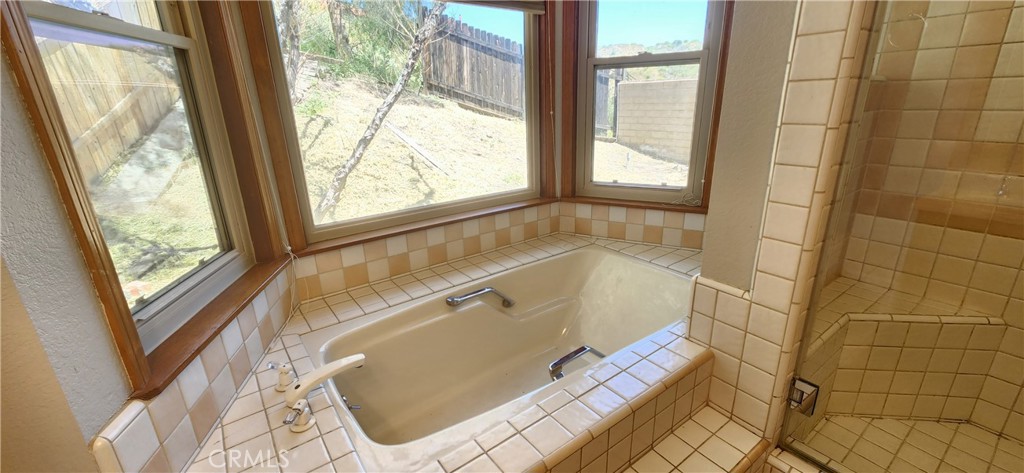29932 Louis Avenue Canyon Country, CA 91351 - Photo 25 of 46 a bath tub sitting in front of a window