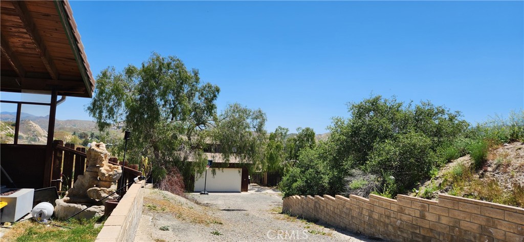 29932 Louis Avenue Canyon Country, CA 91351 - Photo 28 of 46 a view of a terrace with a garden