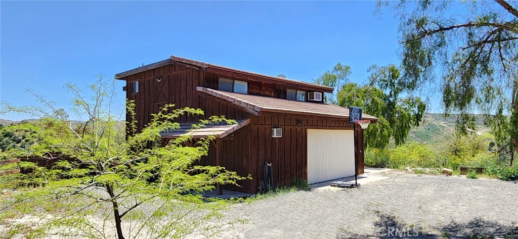 29932 Louis Avenue Canyon Country, CA 91351 - Photo 32 of 46 a front view of a house with a yard