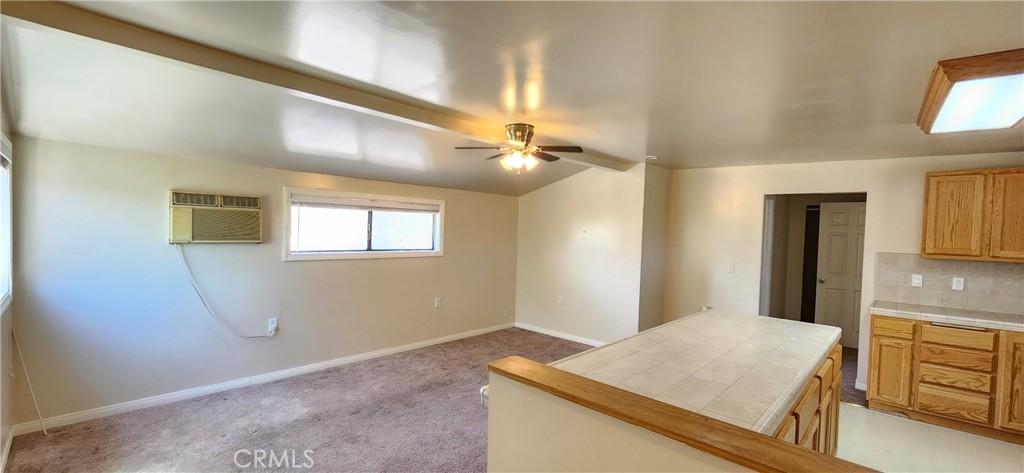 29932 Louis Avenue Canyon Country, CA 91351 - Photo 37 of 46 a view of a hallway with a kitchen