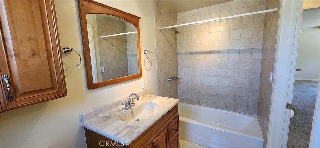 29932 Louis Avenue Canyon Country, CA 91351 - Photo 44 of 46 a bathroom with a bathtub and a sink