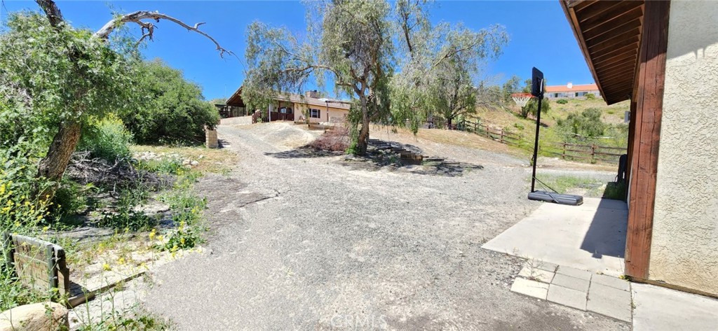 29932 Louis Avenue Canyon Country, CA 91351 - Photo 45 of 46 a view of a patio with a table and chairs and couches