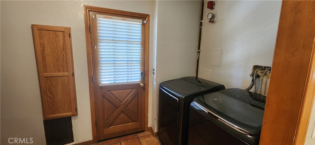29932 Louis Avenue Canyon Country, CA 91351 - Photo 7 of 46 a kitchen with a refrigerator and a stove