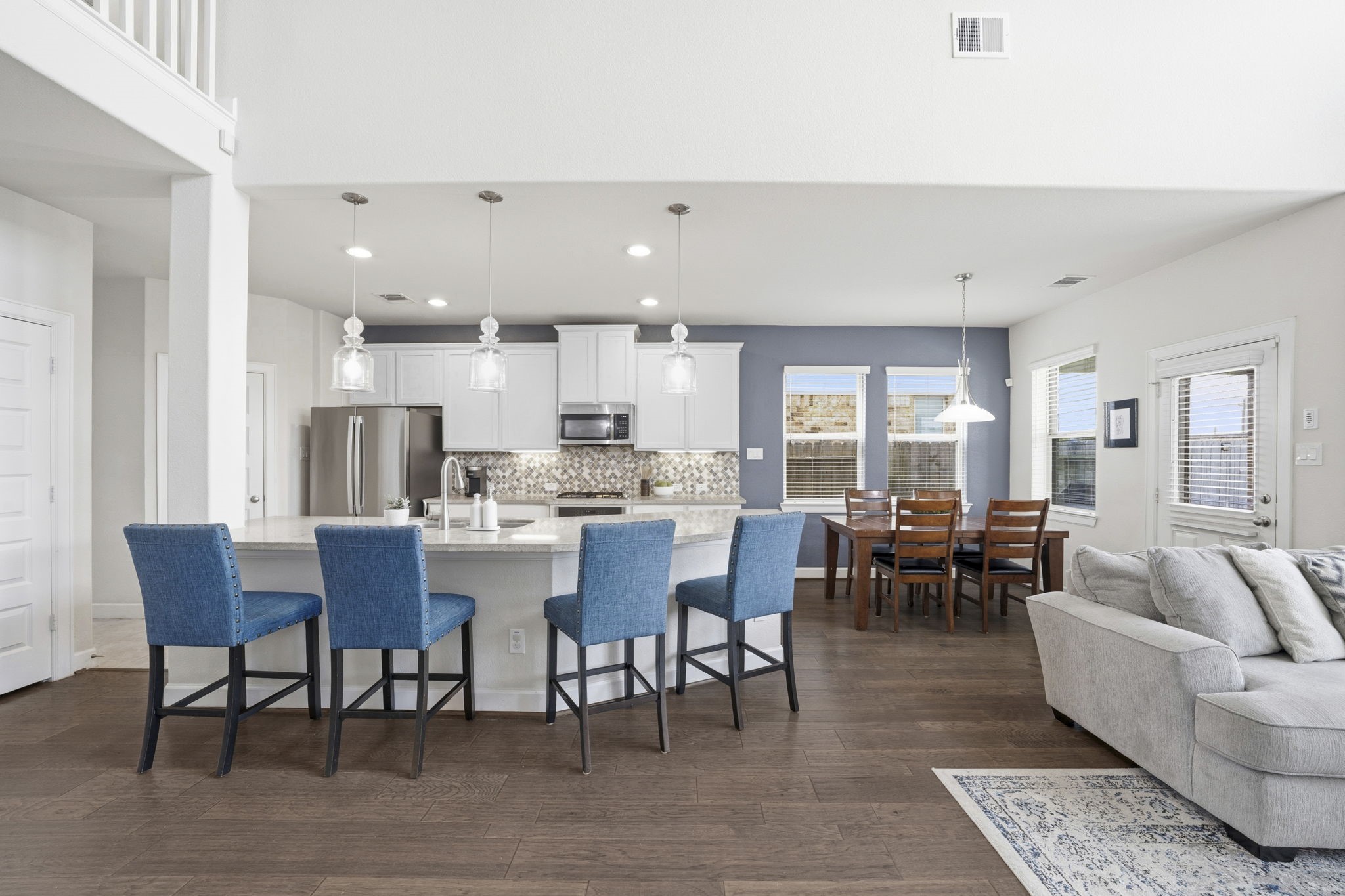 7618 Trailing Oaks Drive Spring, TX 77379 - Photo 11 of 33 a large kitchen with a table and chairs