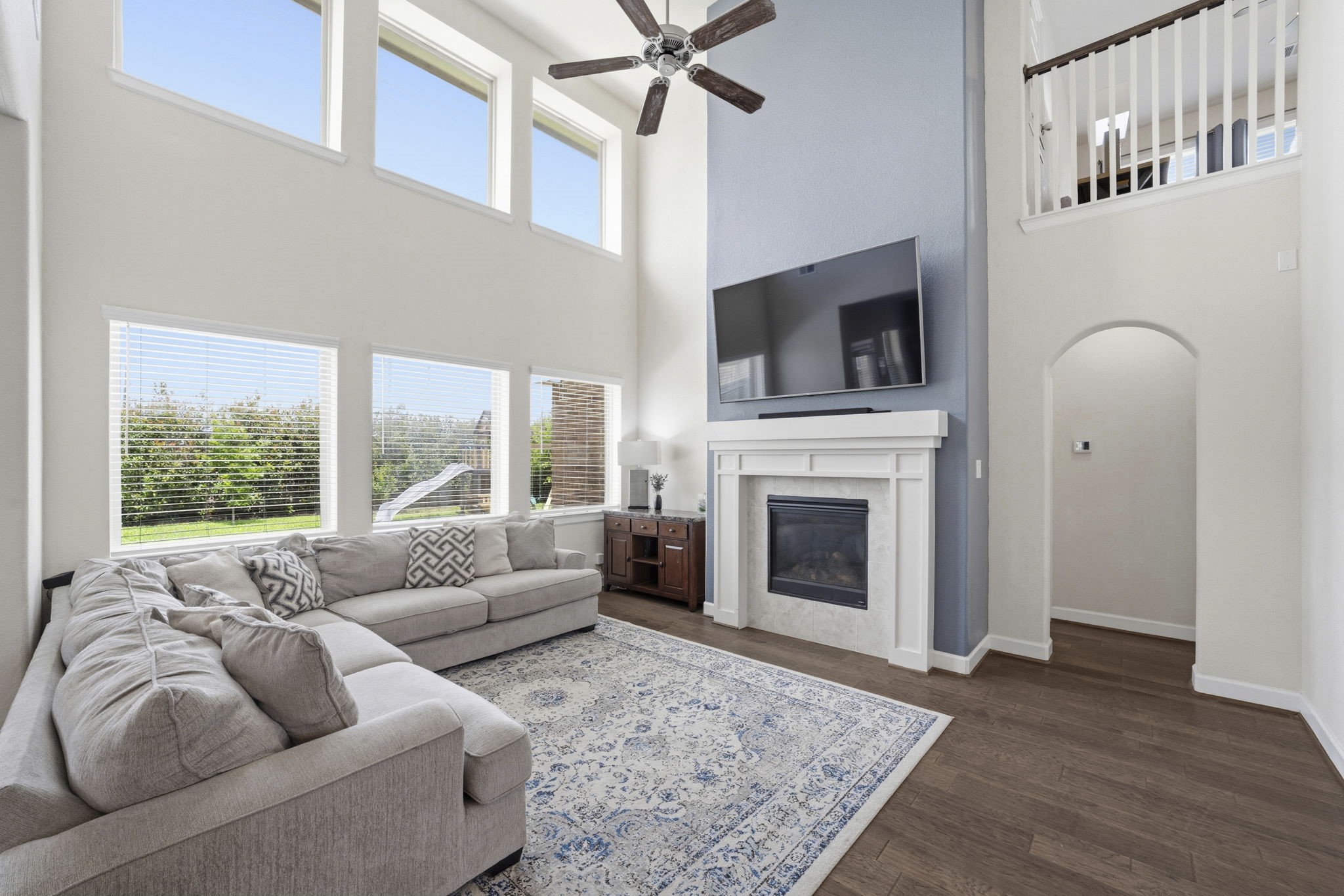 7618 Trailing Oaks Drive Spring, TX 77379 - Photo 13 of 33 a living room with furniture and a fireplace