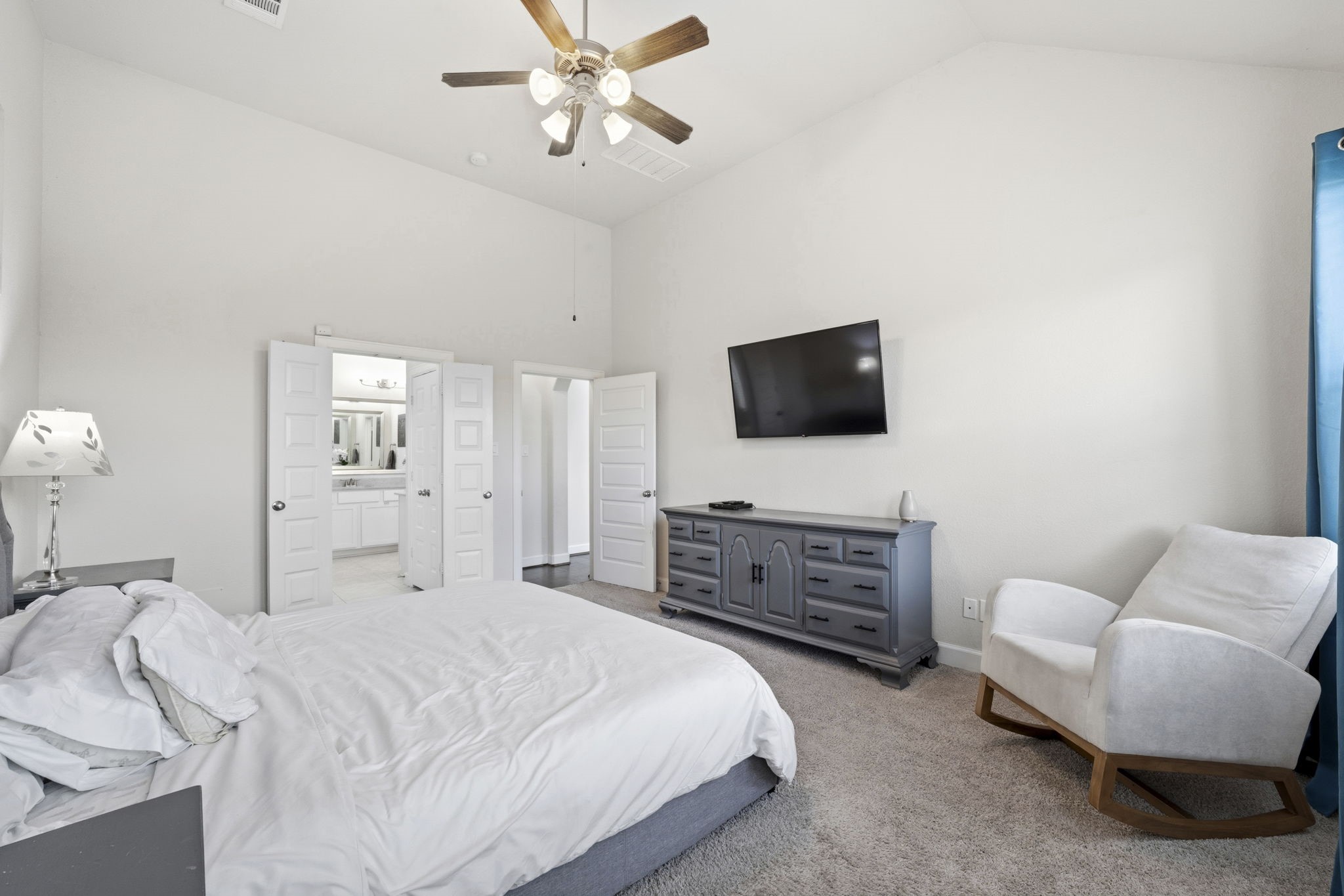 7618 Trailing Oaks Drive Spring, TX 77379 - Photo 17 of 33 a bedroom with a bed and a flat screen tv
