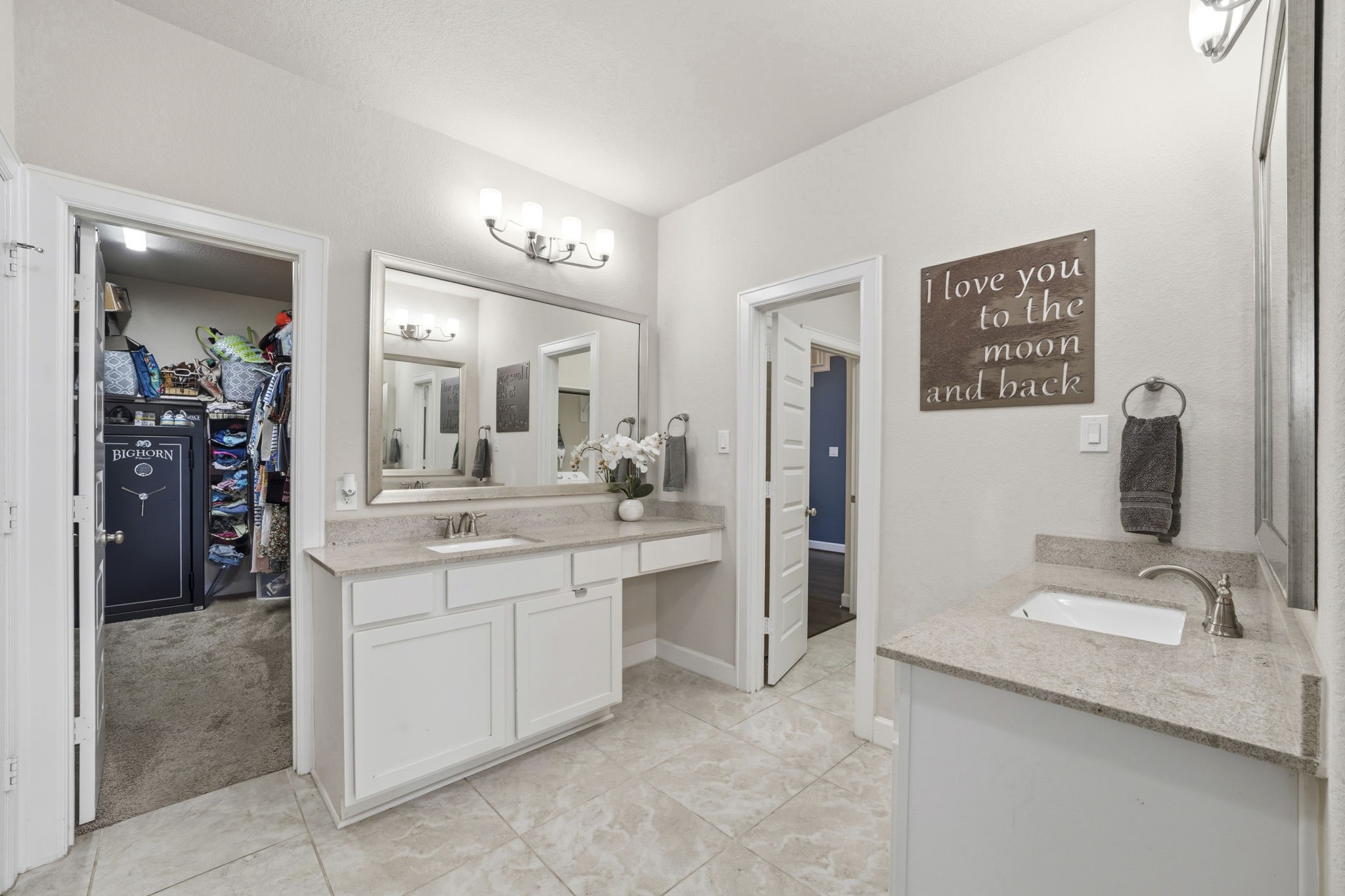 7618 Trailing Oaks Drive Spring, TX 77379 - Photo 19 of 33 a bathroom with a granite countertop sink and a mirror
