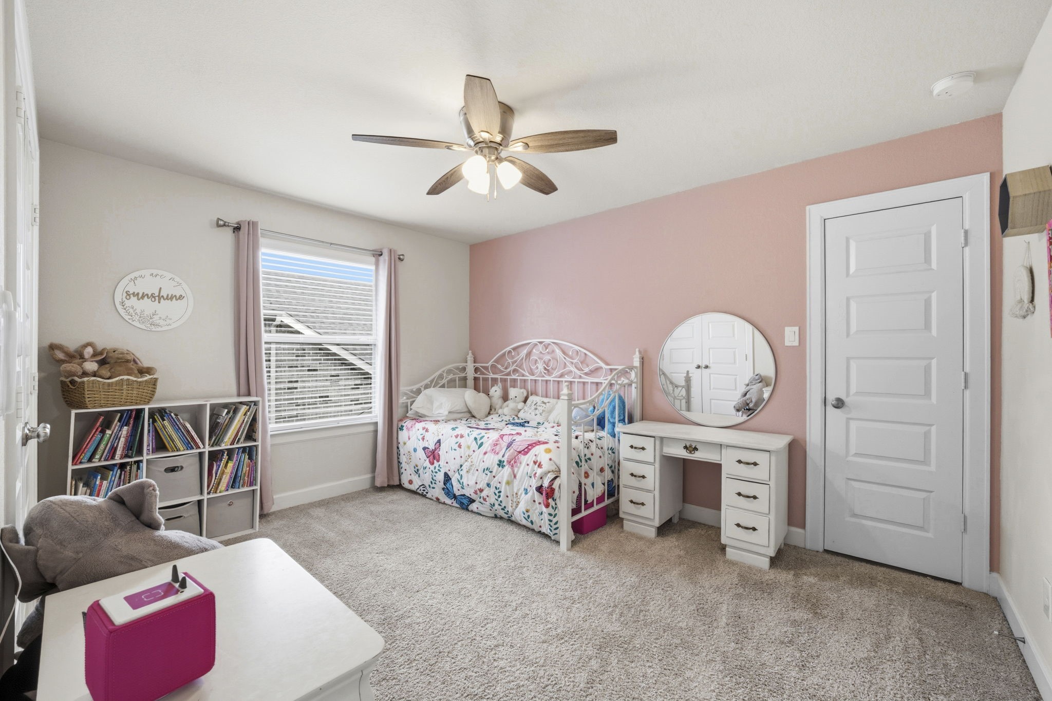 7618 Trailing Oaks Drive Spring, TX 77379 - Photo 24 of 33 a bed room with a bed and a chandelier