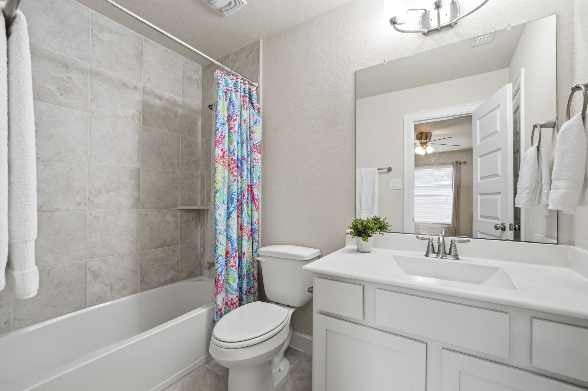 7618 Trailing Oaks Drive Spring, TX 77379 - Photo 26 of 33 a bathroom with a sink toilet and shower