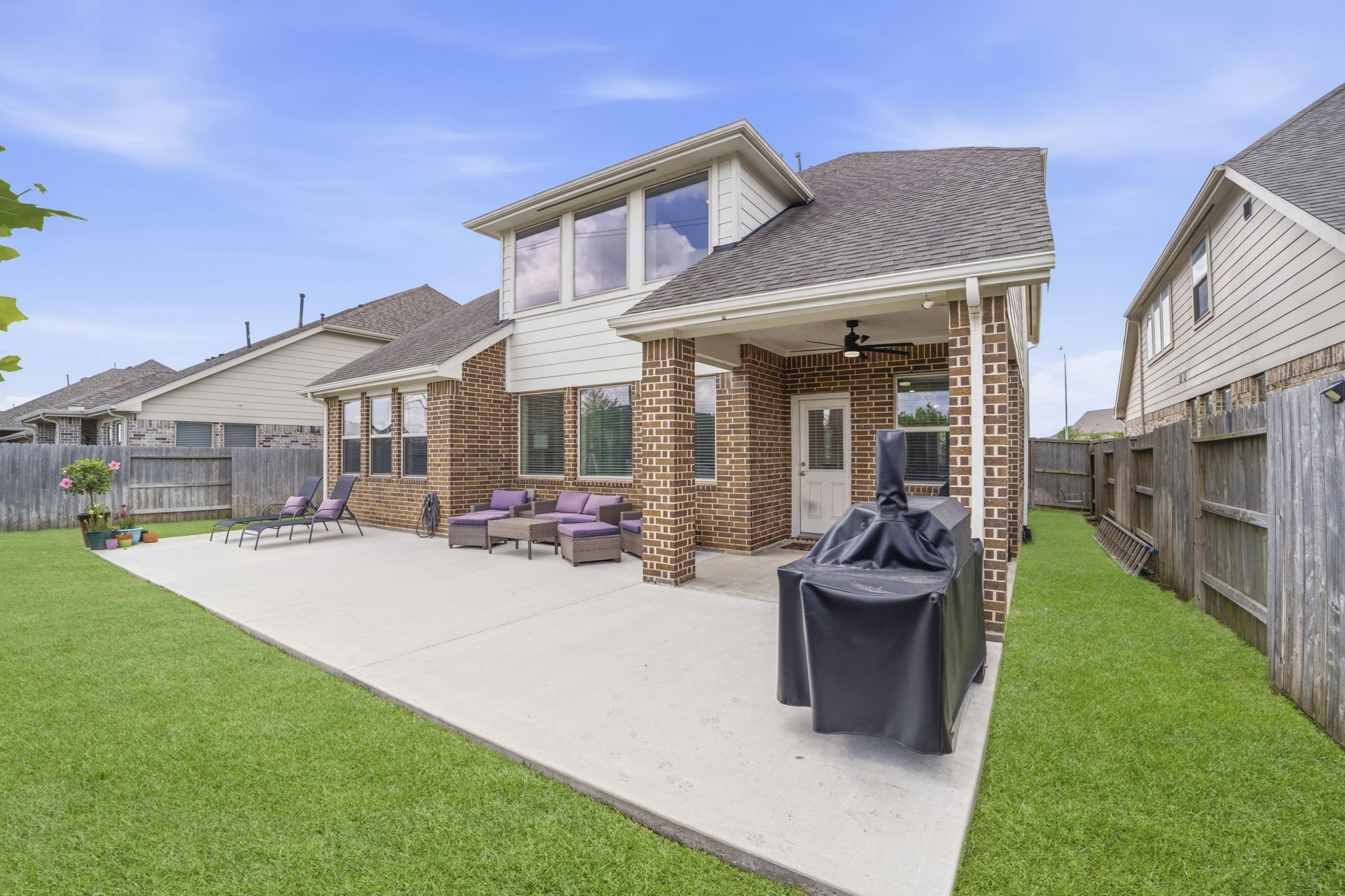 7618 Trailing Oaks Drive Spring, TX 77379 - Photo 30 of 33 a view of a house with backyard porch and sitting area