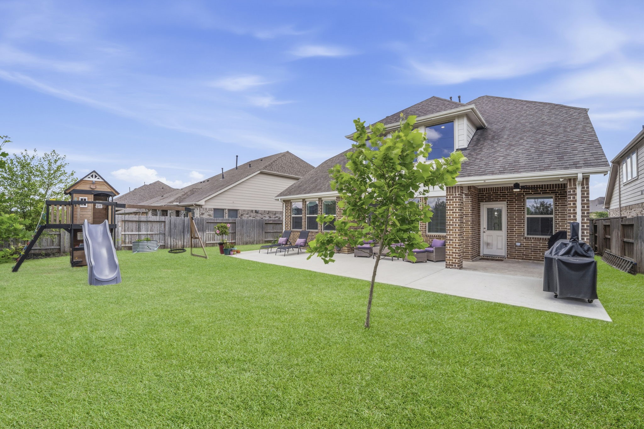 7618 Trailing Oaks Drive Spring, TX 77379 - Photo 31 of 33 a view of a house with a yard porch and sitting area