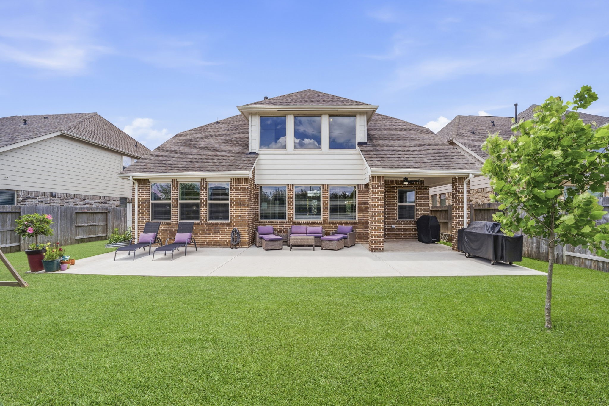 7618 Trailing Oaks Drive Spring, TX 77379 - Photo 32 of 33 a front view of a house with a yard and patio
