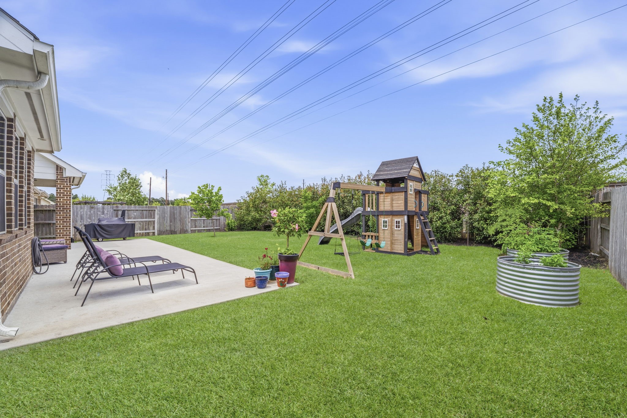 7618 Trailing Oaks Drive Spring, TX 77379 - Photo 33 of 33 a view of a table and chairs in the garden