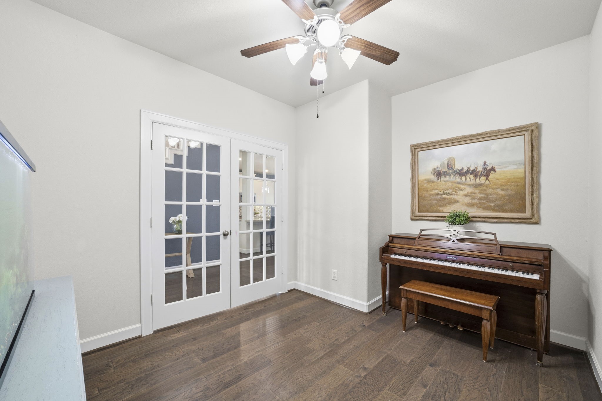 7618 Trailing Oaks Drive Spring, TX 77379 - Photo 4 of 33 a living room with furniture and a piano
