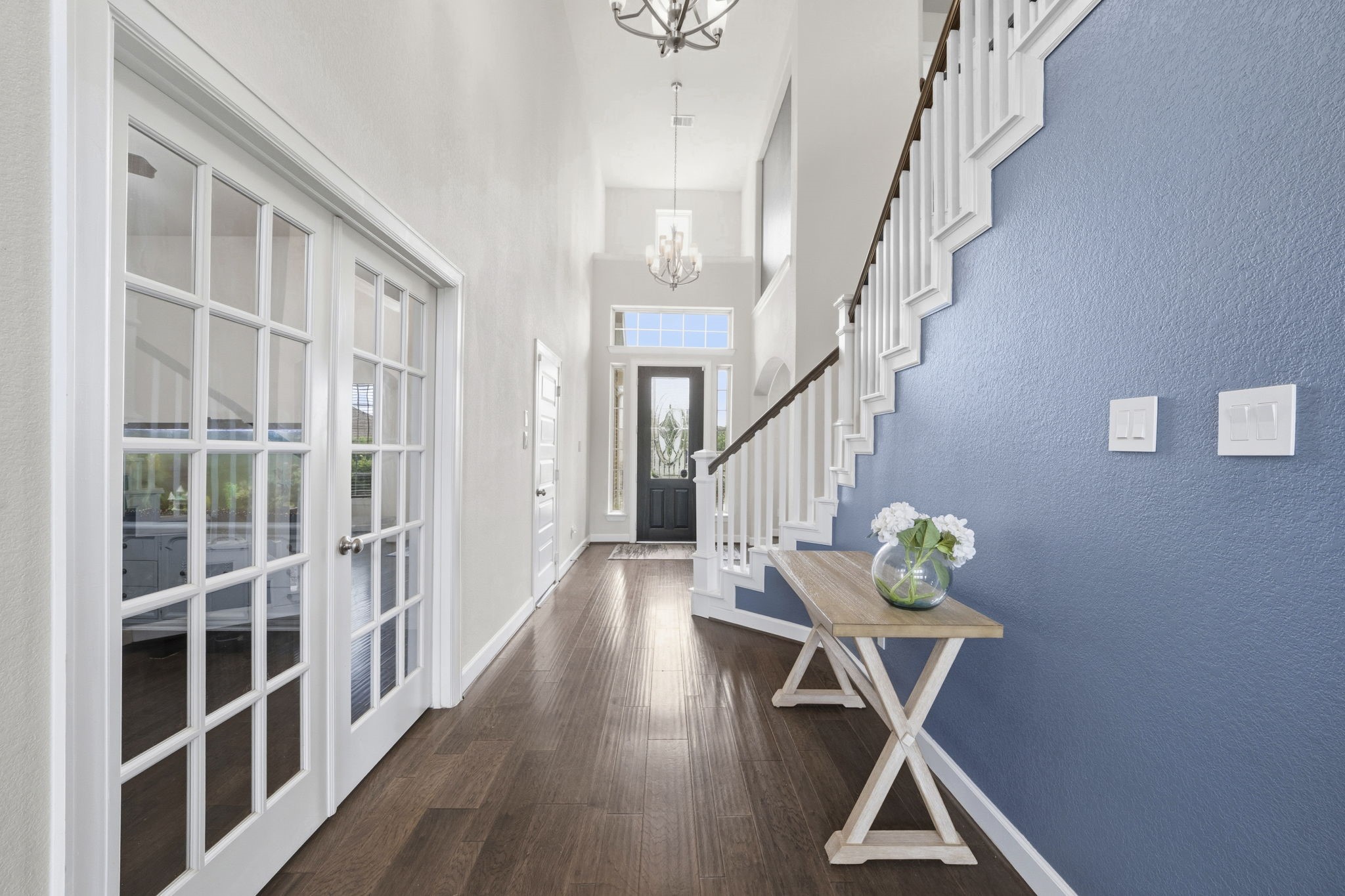 7618 Trailing Oaks Drive Spring, TX 77379 - Photo 7 of 33 a view of entryway and hall with wooden floor