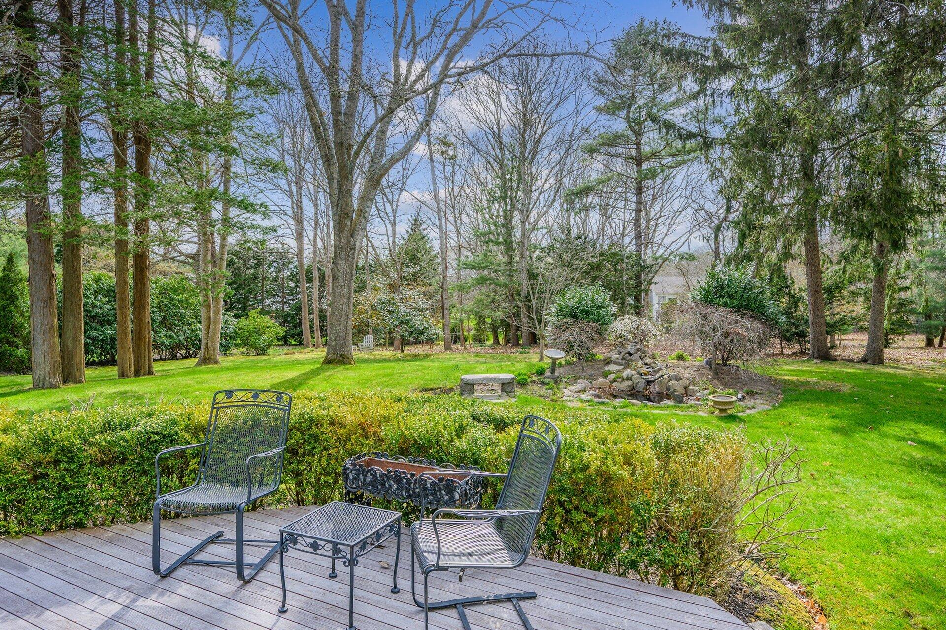 81 Osterville West Barnstable Road Osterville, MA 02655 - Photo 4 of 41 a view of backyard with seating and green space