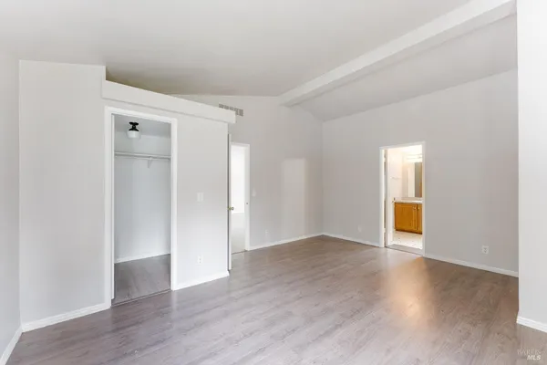a bathroom with a sink a toilet a mirror and vanity