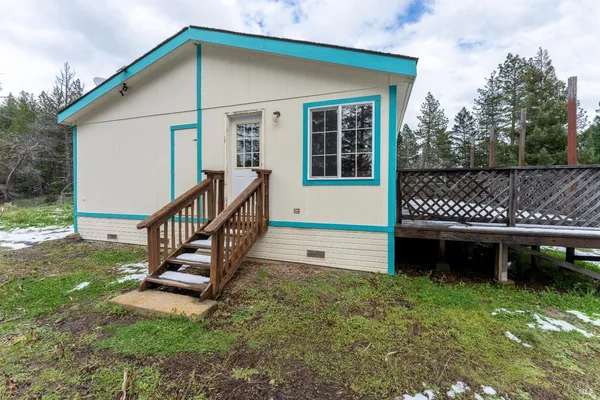 a view of a golf course with a wooden fence