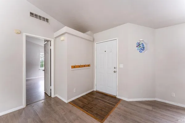 a view of a kitchen cabinets and wooden floor