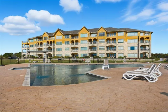 a view of pool with outdoor seating